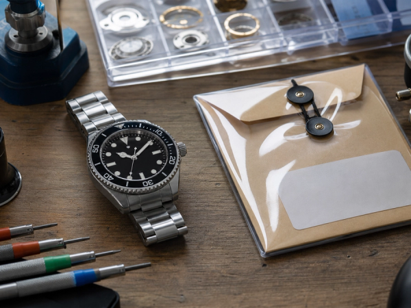 Mechanical watch inspected with timing and pressure-test equipment