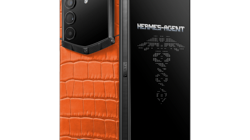 A VERTU AlphaFold in a bespoke alligator skin finish being presented in its luxury case.