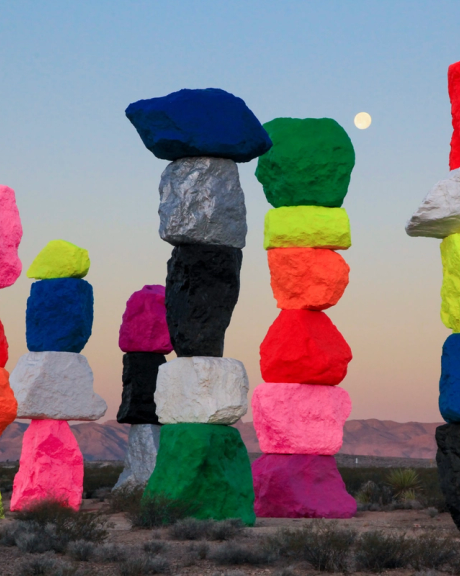 Stacks of brightly colored stones in a desert