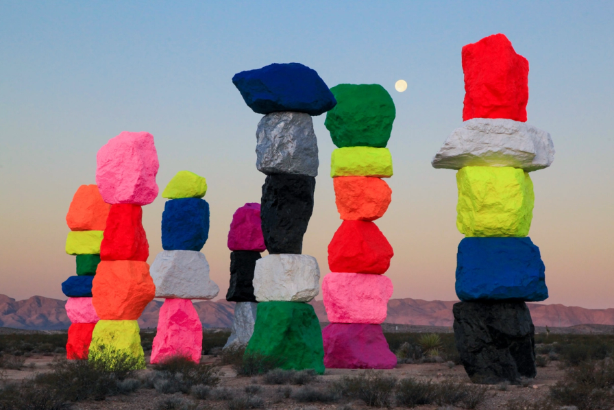 Colourful stacked stone sculptures in a desert landscape