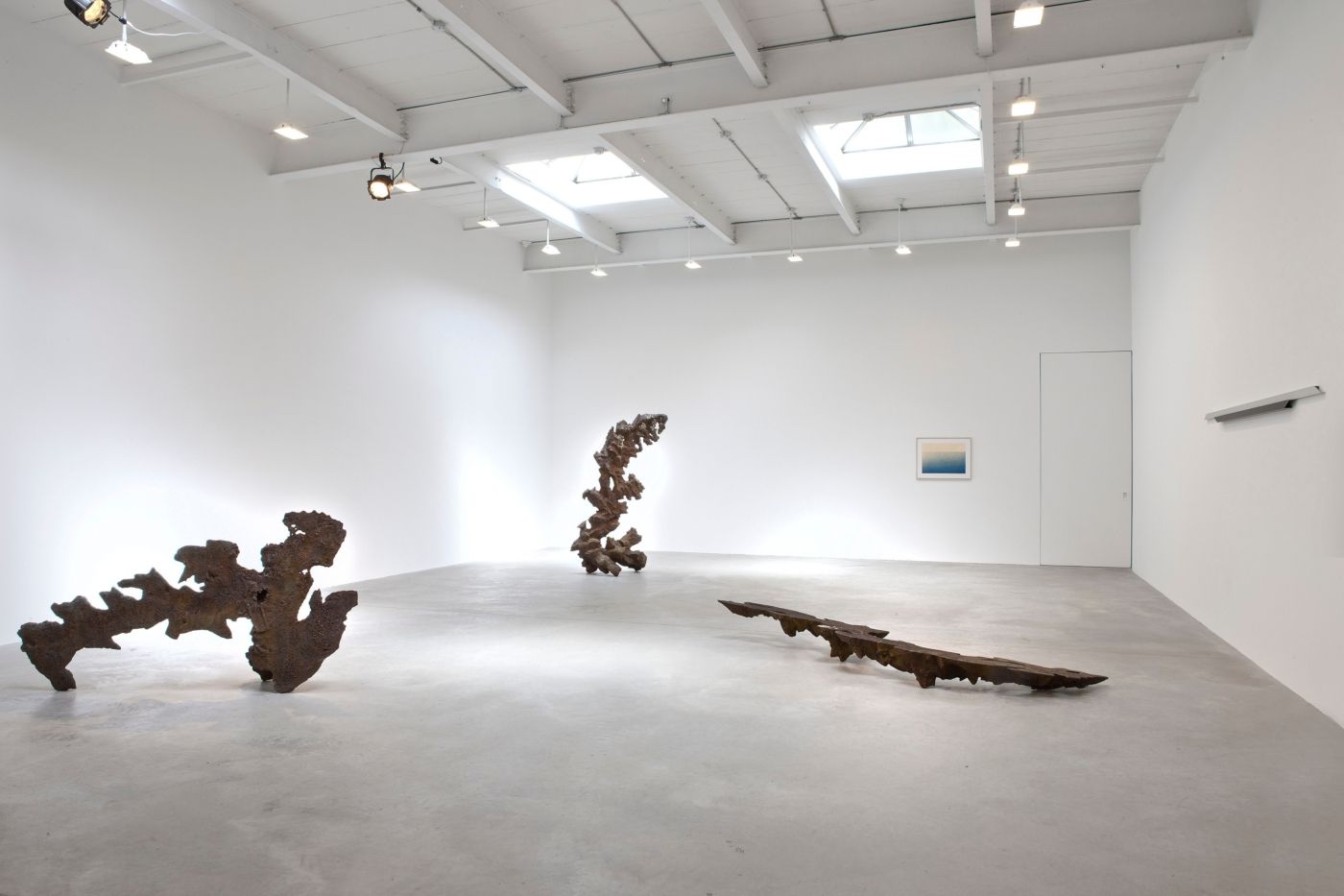 Sculptures exhibited in a white gallery