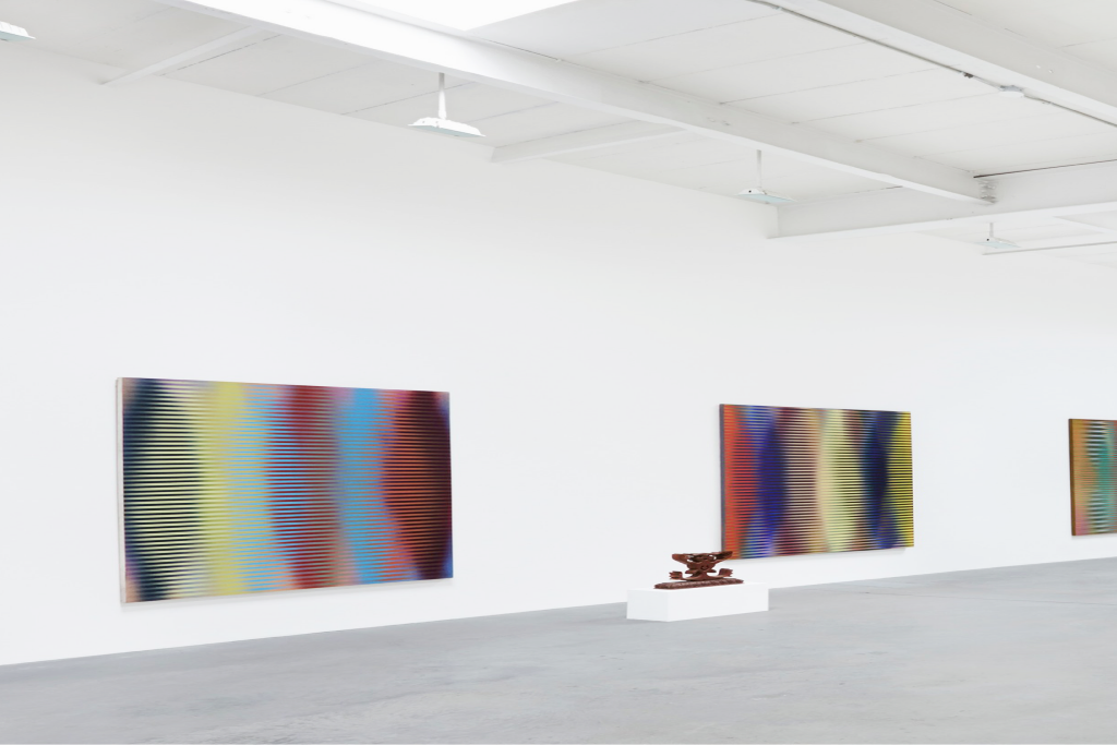 White gallery interior with artworks
