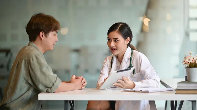 Private GP with patient