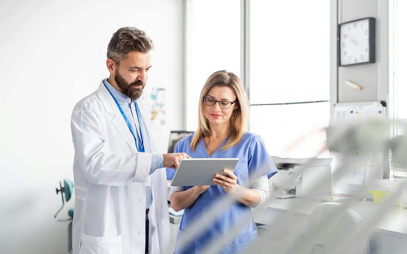 Clinicians looking at iPad