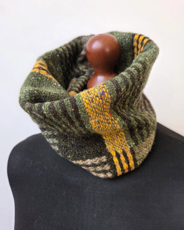 Handwoven merino wool cowl in shades of green, brown and beige with yellow accents