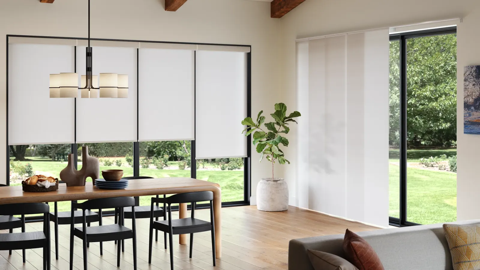Roller shades half-lowered in a bright modern living room