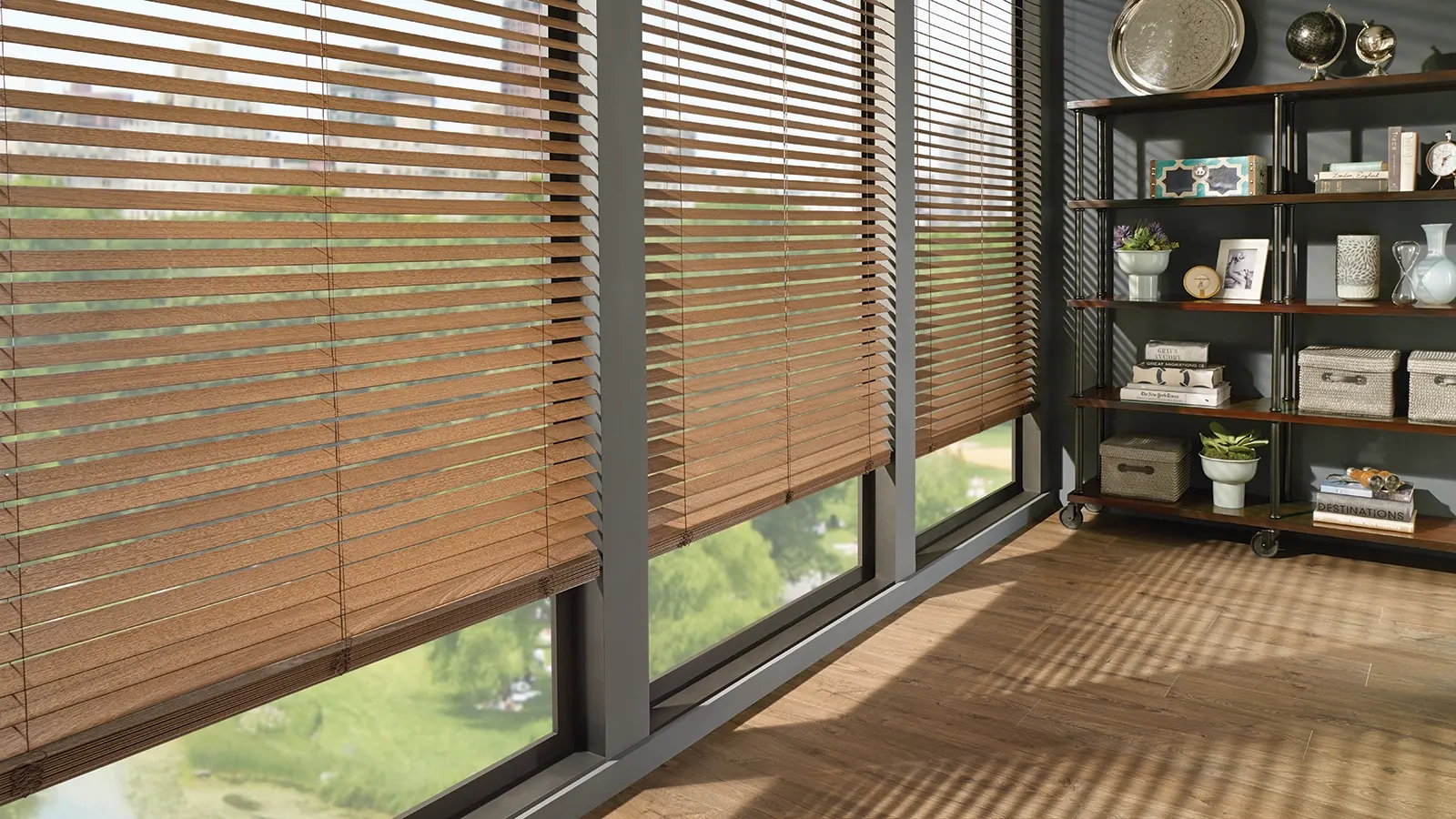Wood blinds tilted open in a sunlit living room