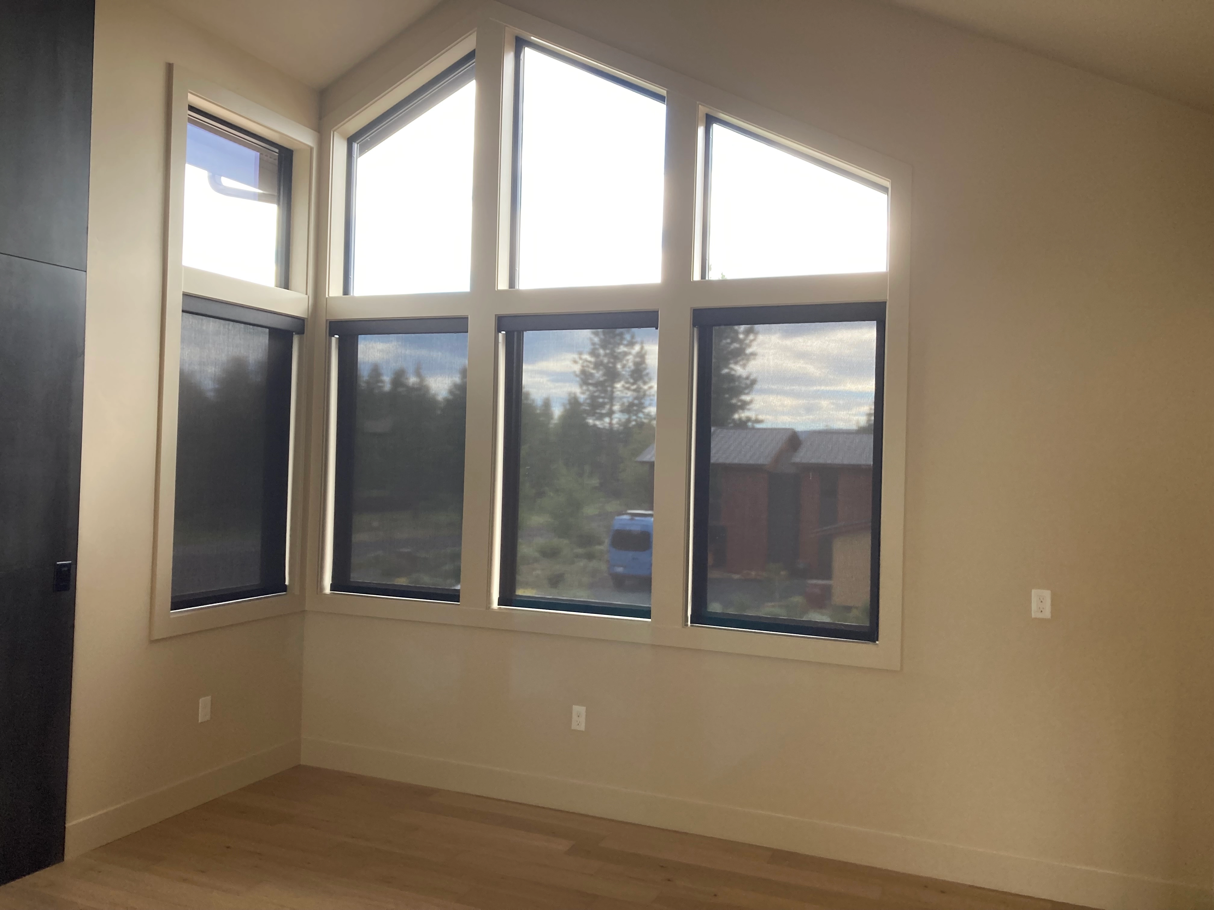 A window with Hunter Douglas shades.