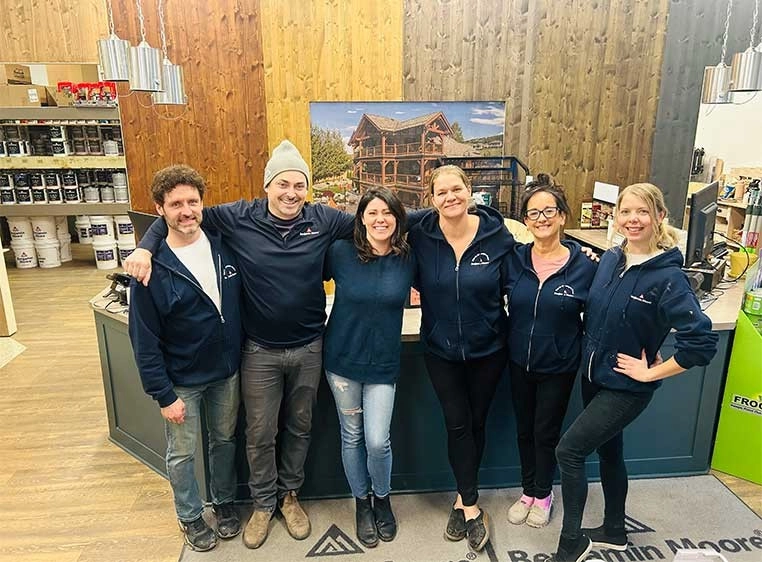Company staff posing for a photo in the showroom