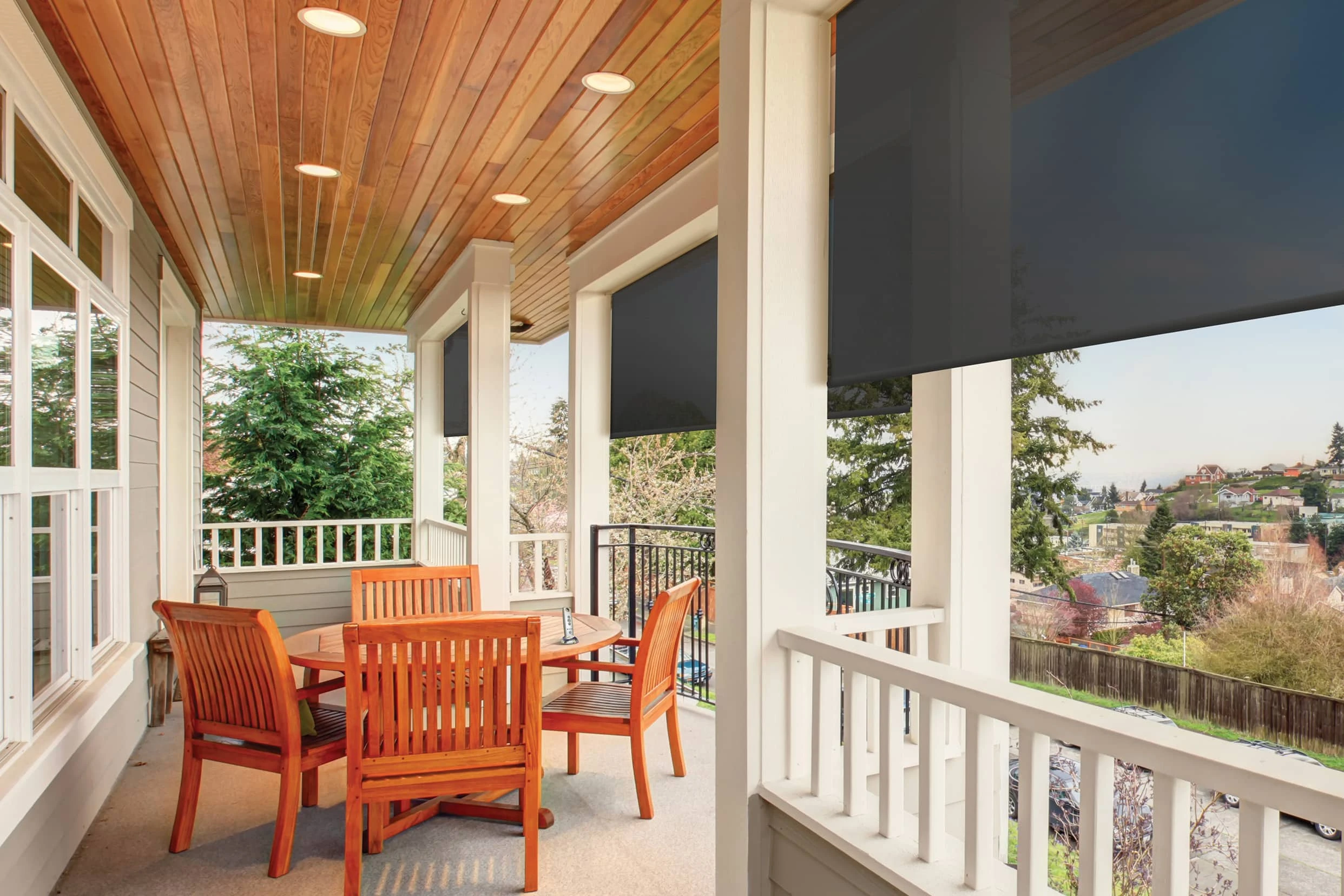 Outdoor shades, awnings, and enclosures by JM Windows.