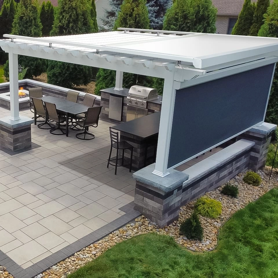 Outdoor shades, awnings, and enclosures by JM Windows.