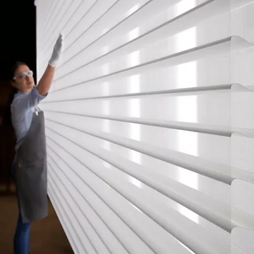 Person inspecting Silhouette window covering