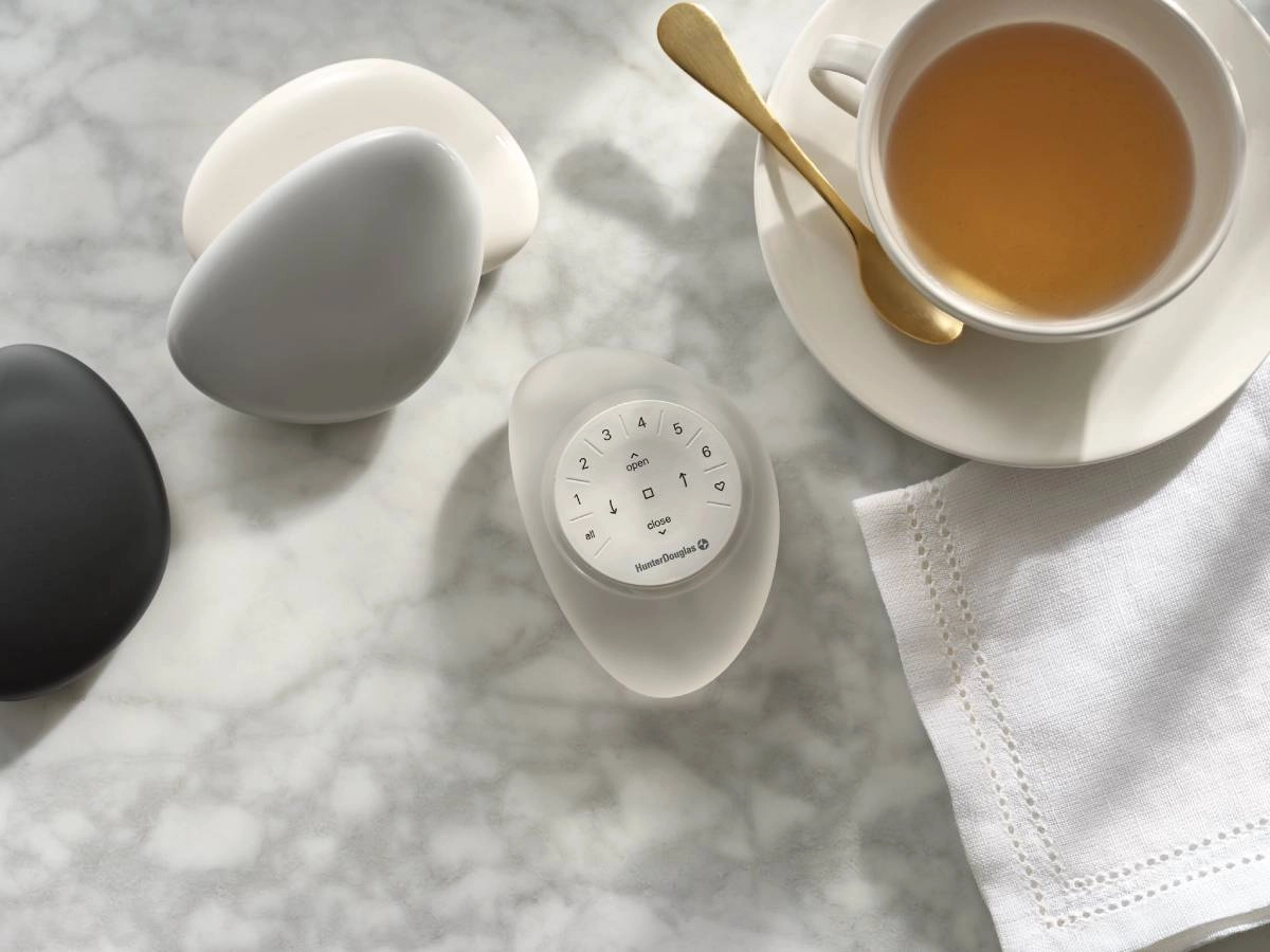 Hunter Douglas PowerView® Automation remote on a marble counter.