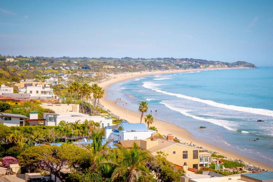 Scenic view of a shoreline filled with houses in Malibu, CA.