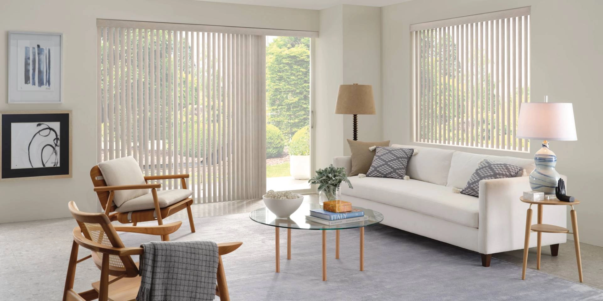Hunter Douglas Somner® Vertical Blinds on sliding door and window in a chic living room