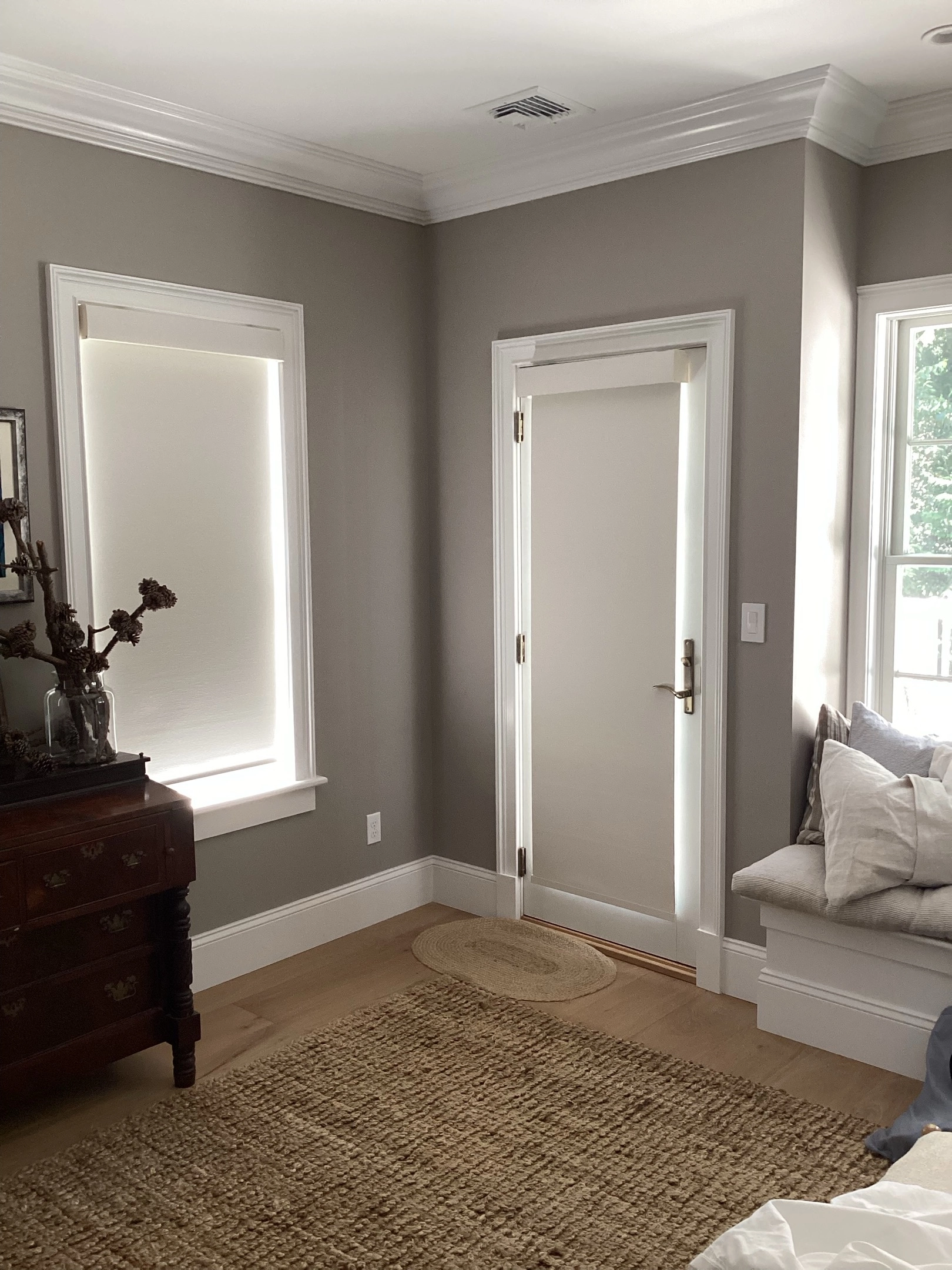 Entry way door and windows with Hunter Douglas shades.