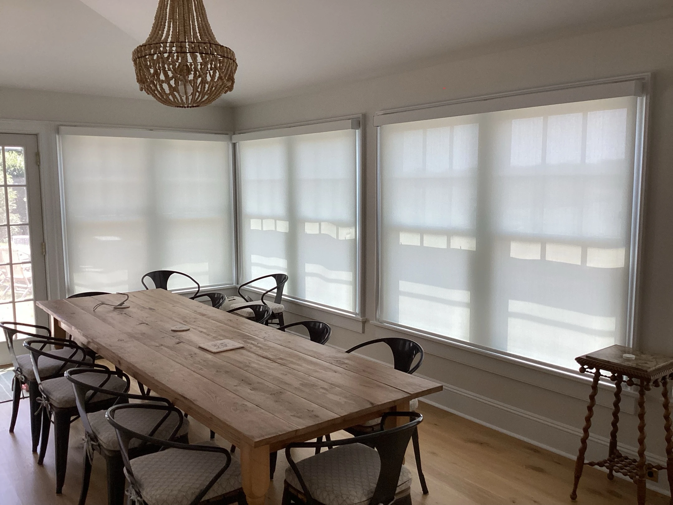 Dining room windows with Hunter Douglas shades.