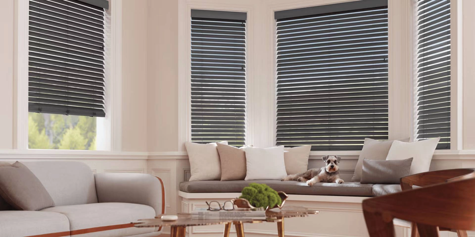 Hunter Douglas wood blinds covering bay windows in a furnished living room near Silver Spring, MD