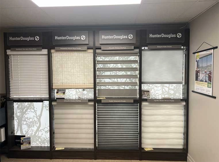 Store interior showcasing several different types of window coverings