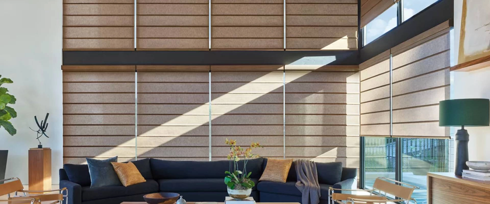 Hunter Douglas Alustra® Roller Shades covering an east-facing window near Gresham, OR