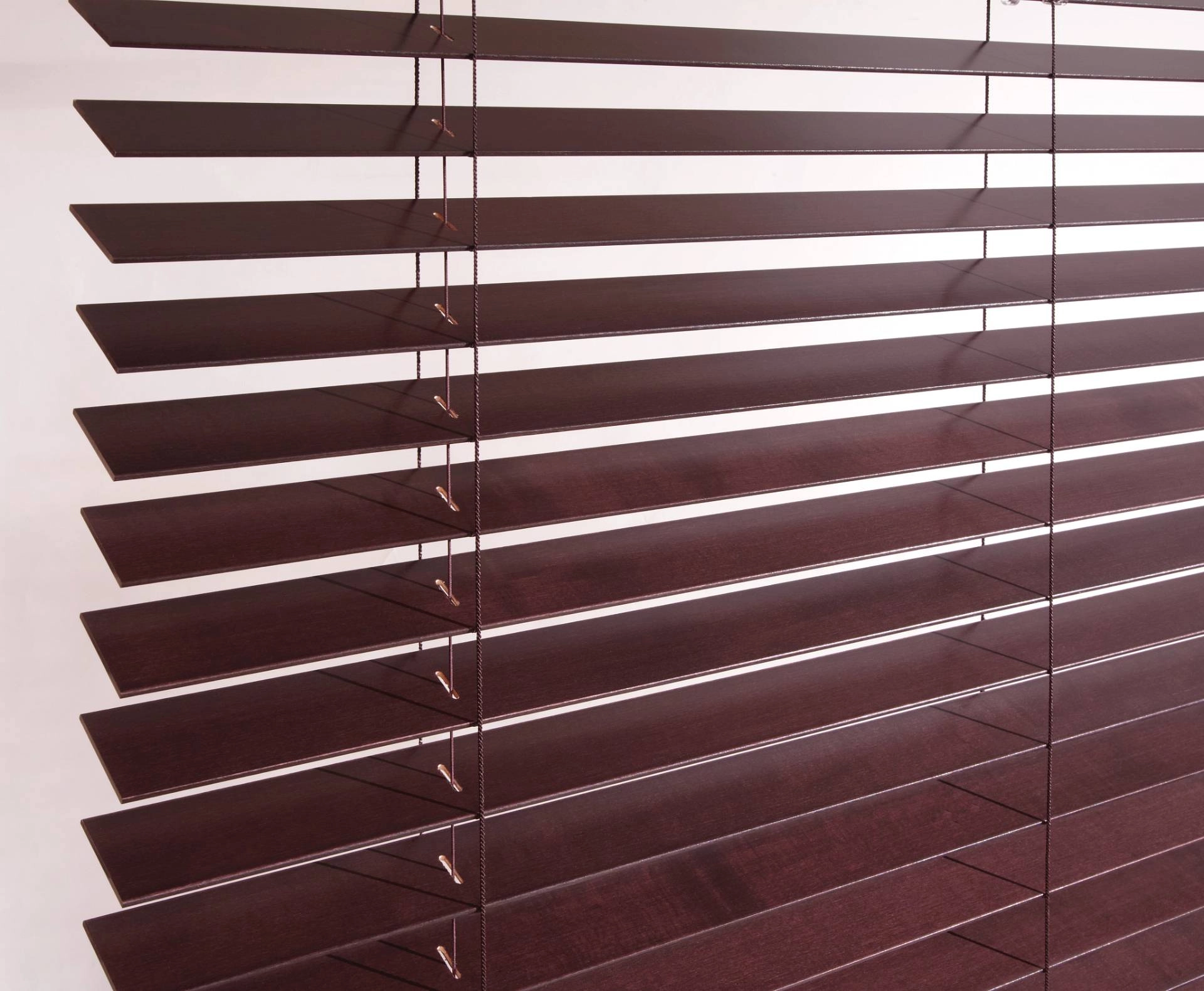 Set of Hunter Douglas Parkland® Wood Blinds covering a window.