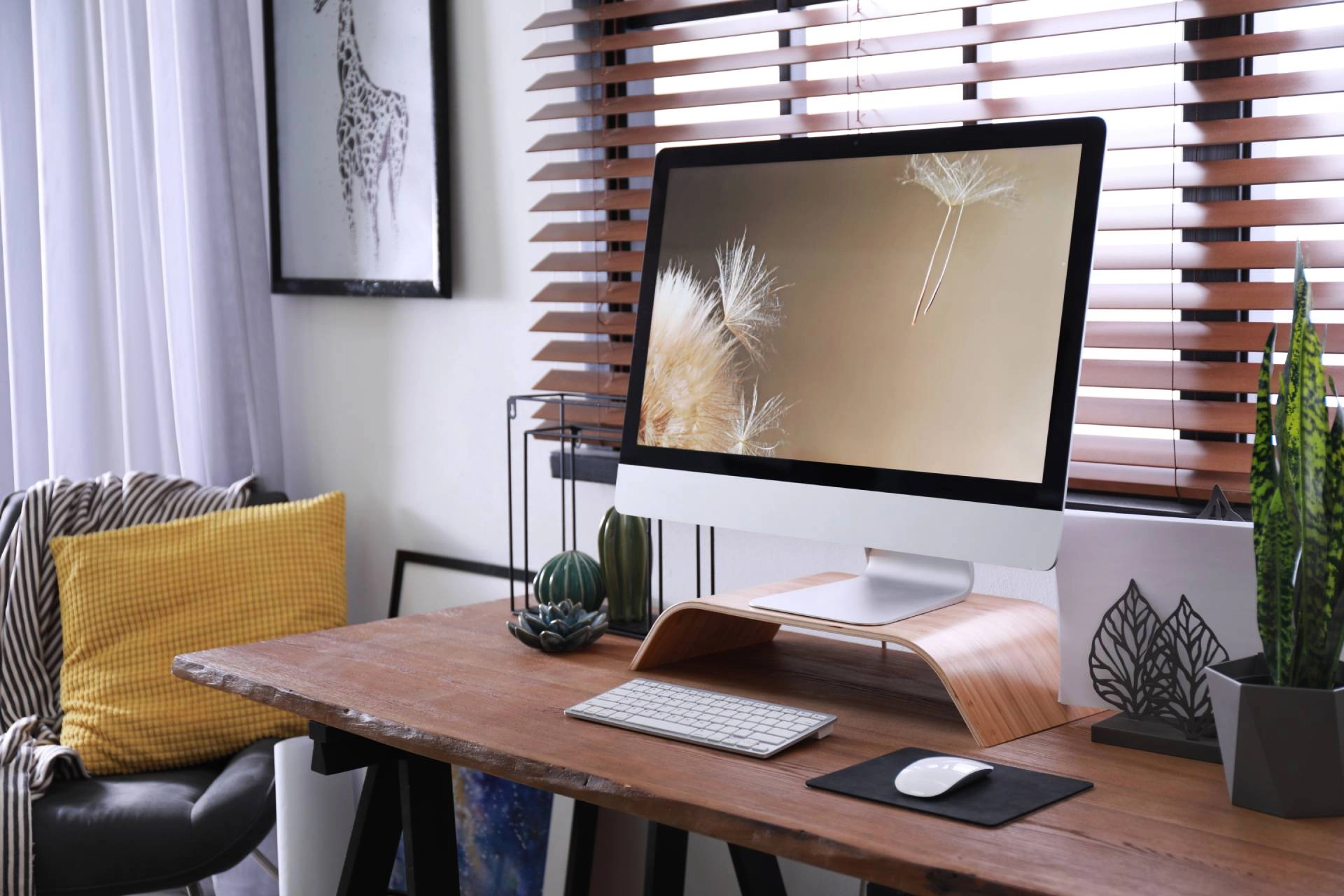 Modern home office with computer desk, accent chair, and custom blinds covering a window near Beaufort, NC