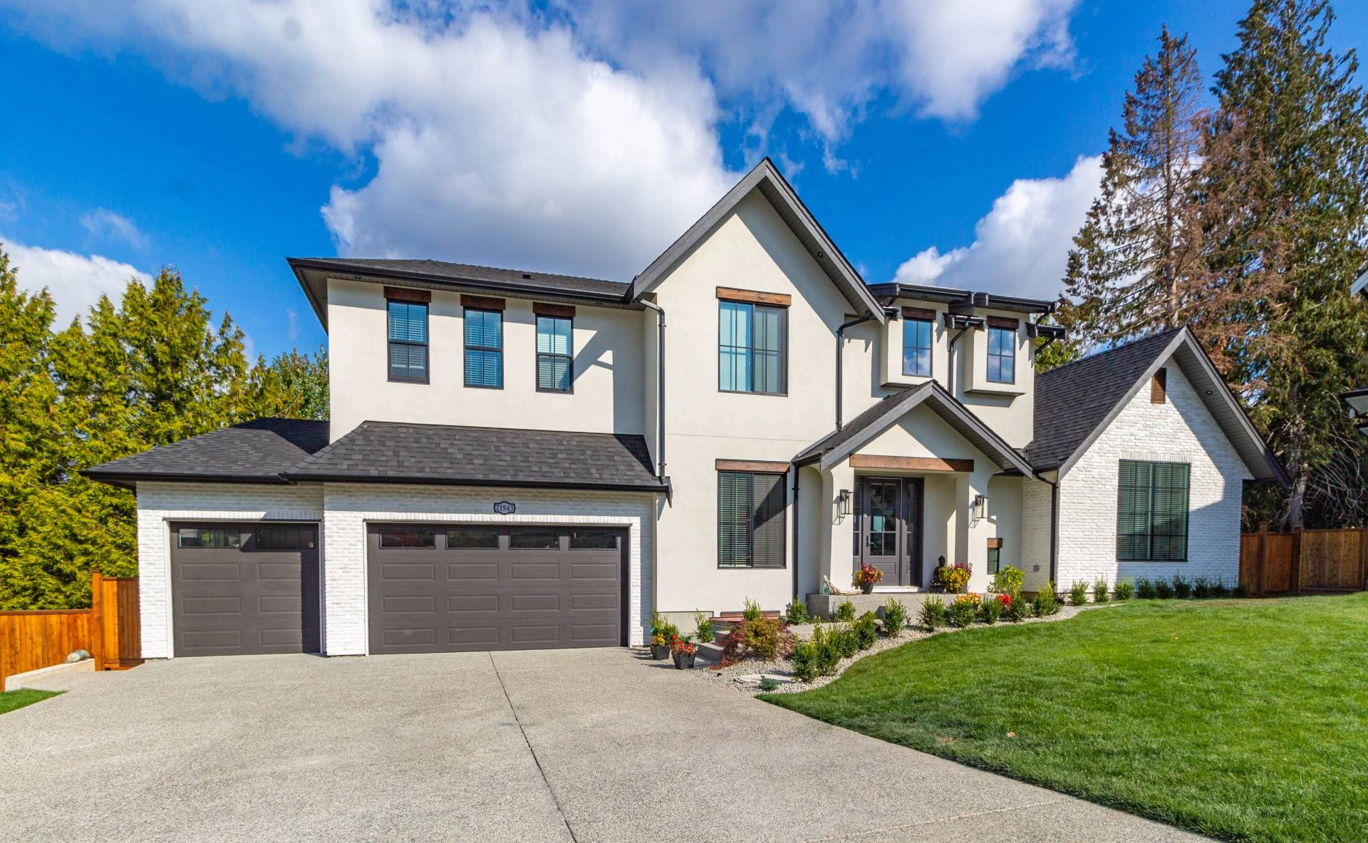 Modern home with two garage doors featuring small windows near Seneca and Greenville, SC.