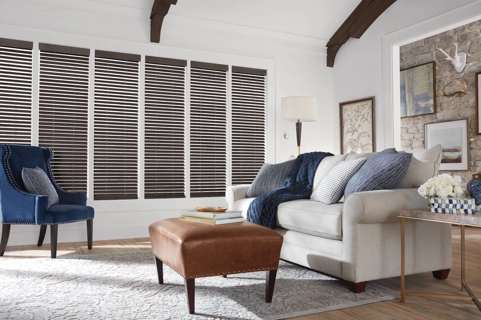 Hunter Douglas wood blinds covering multiple windows in a living room near Brunswick, GA