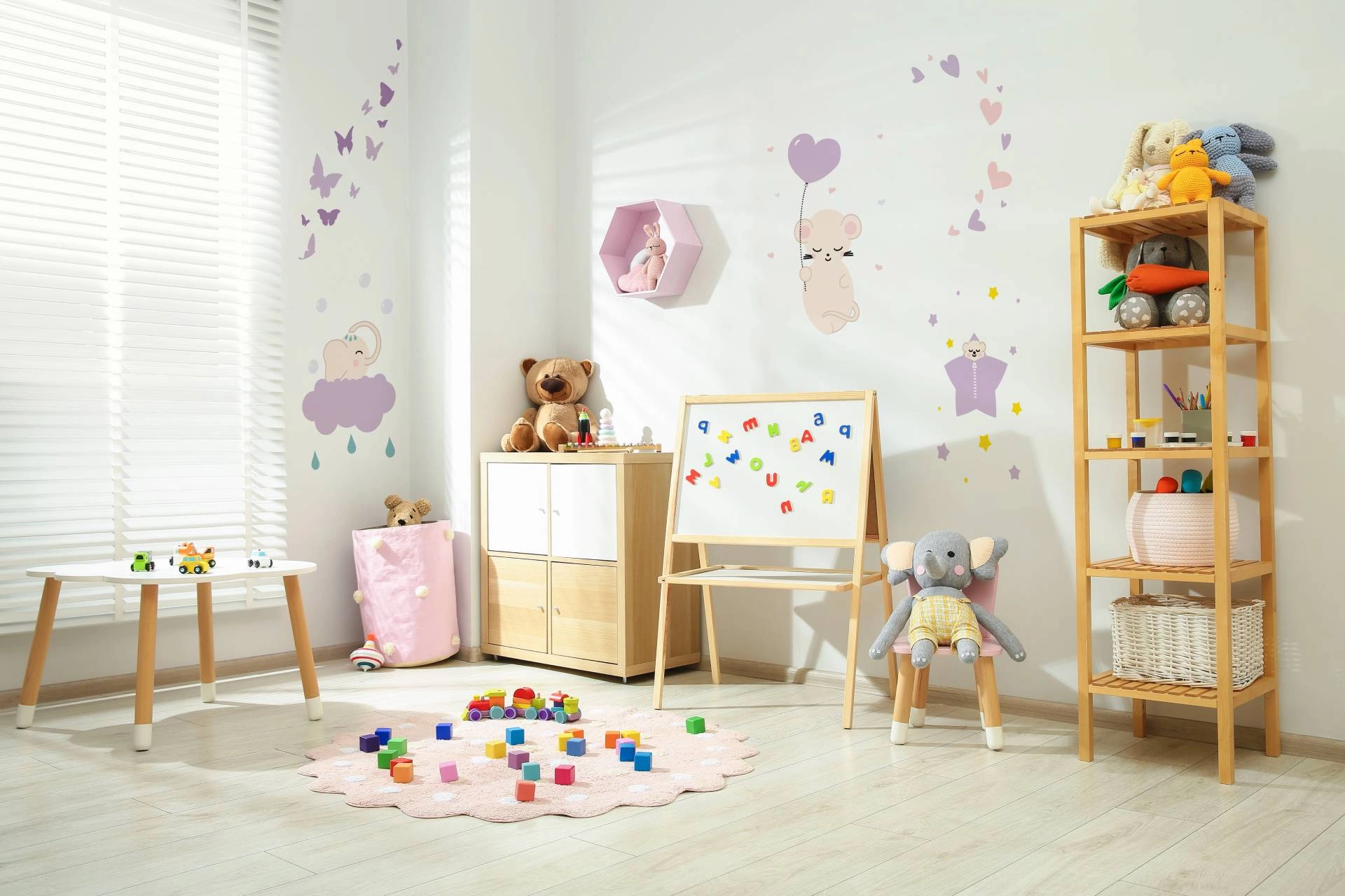 A child's play area with safe and cordless playroom window treatments providing light and privacy control