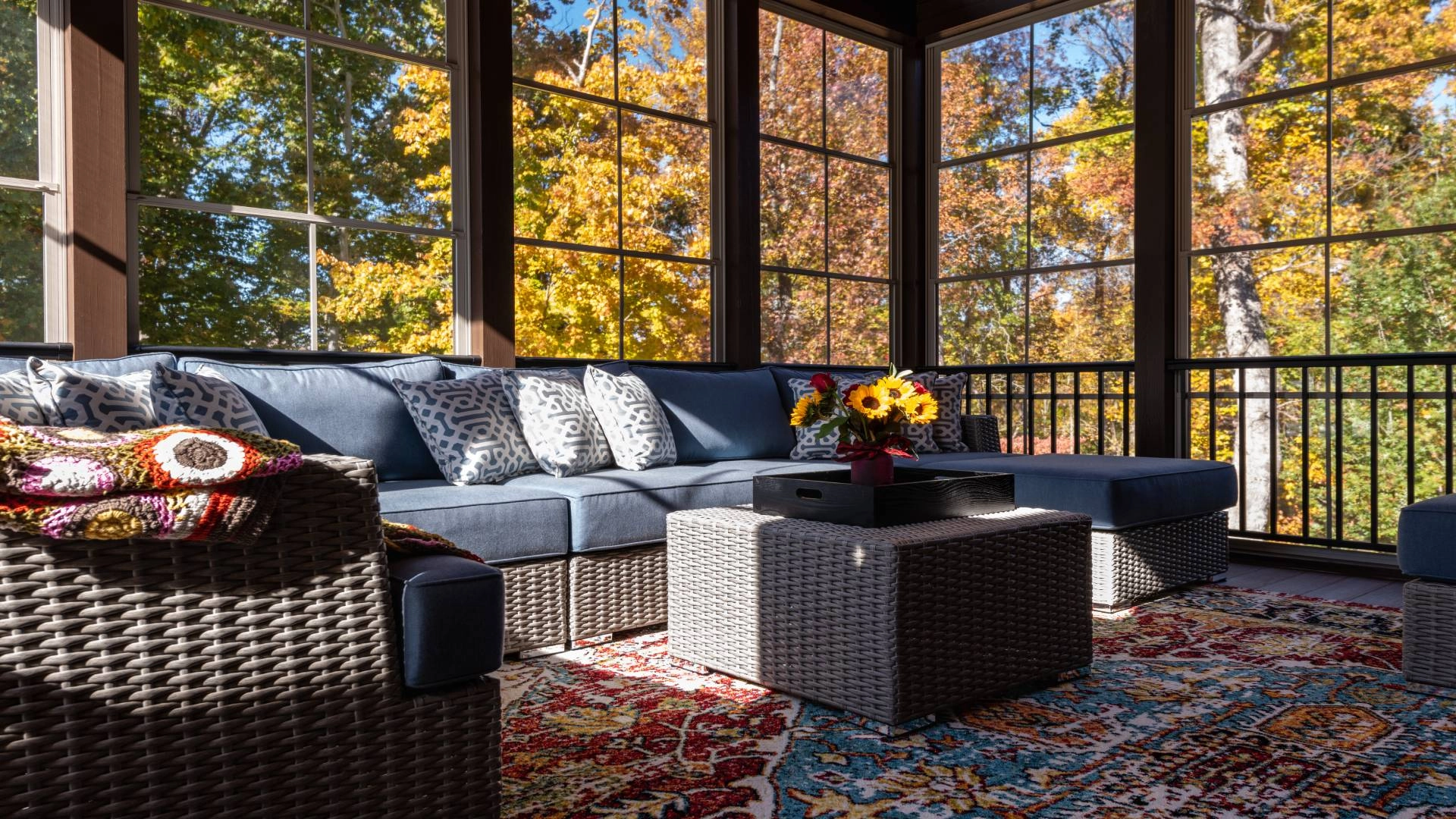 A cozy sunroom with furniture and fall-inspired decor near Vista, CA