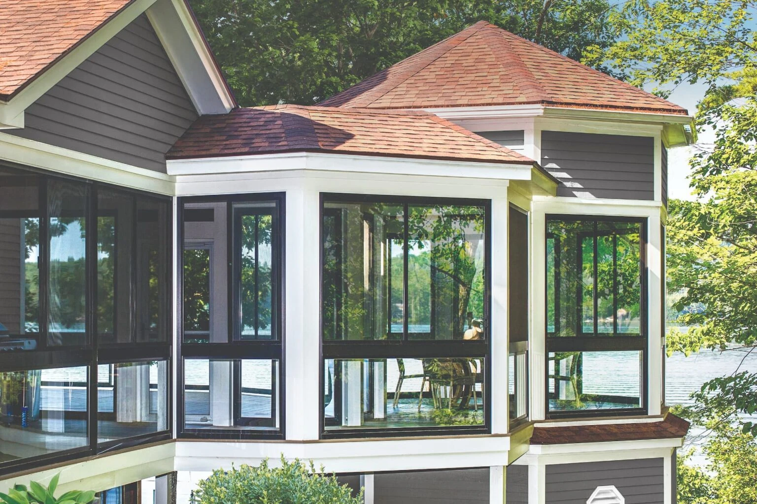 Outdoor shades, awnings, and enclosures by JM Windows.