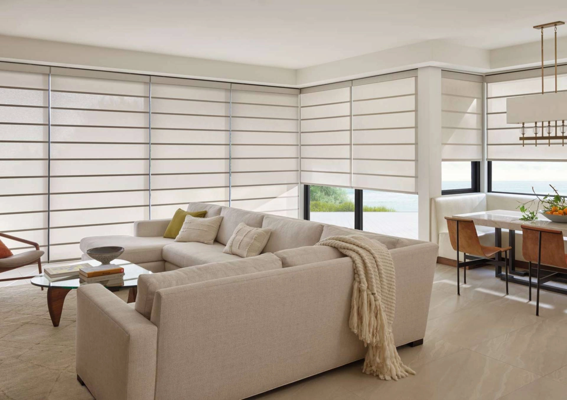 Modern roller shades in a stylish open-concept living room.