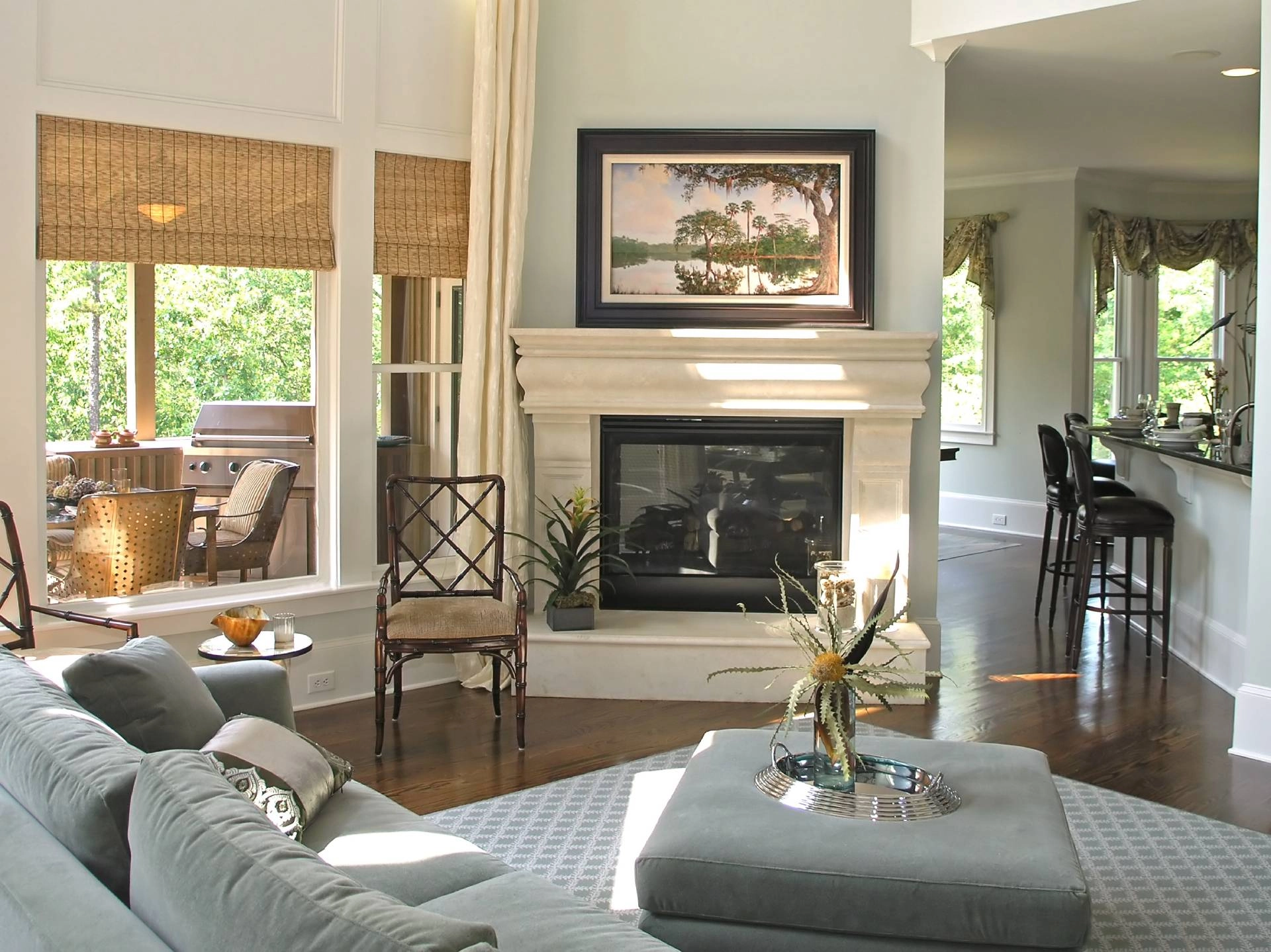 Living room featuring window treatments, sofa, accent chair, and fireplace near Saint George, UT.