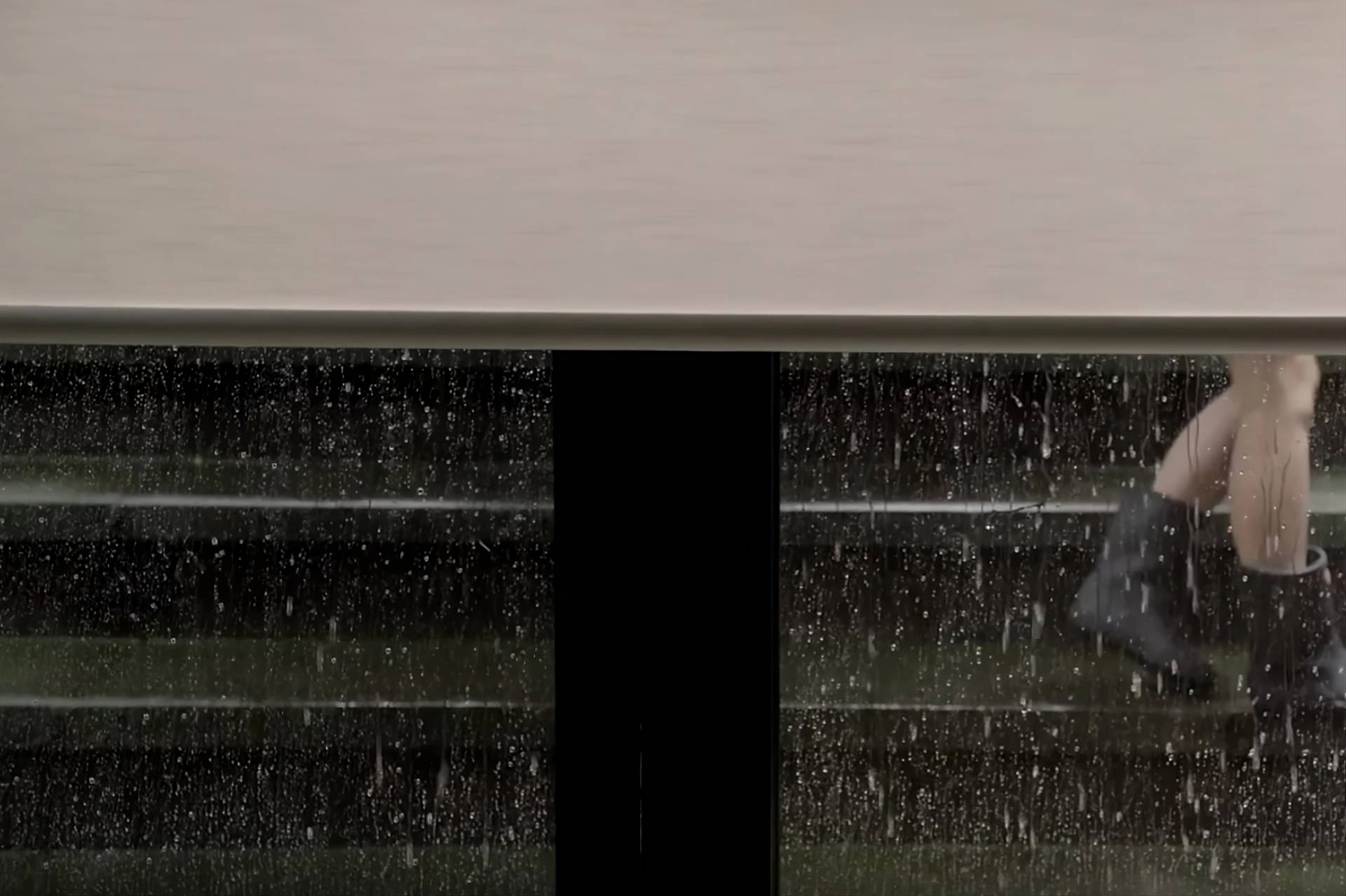 Aura® Illuminated Shades on a window with a view of a rainy day near Oklahoma City, Oklahoma (OK)