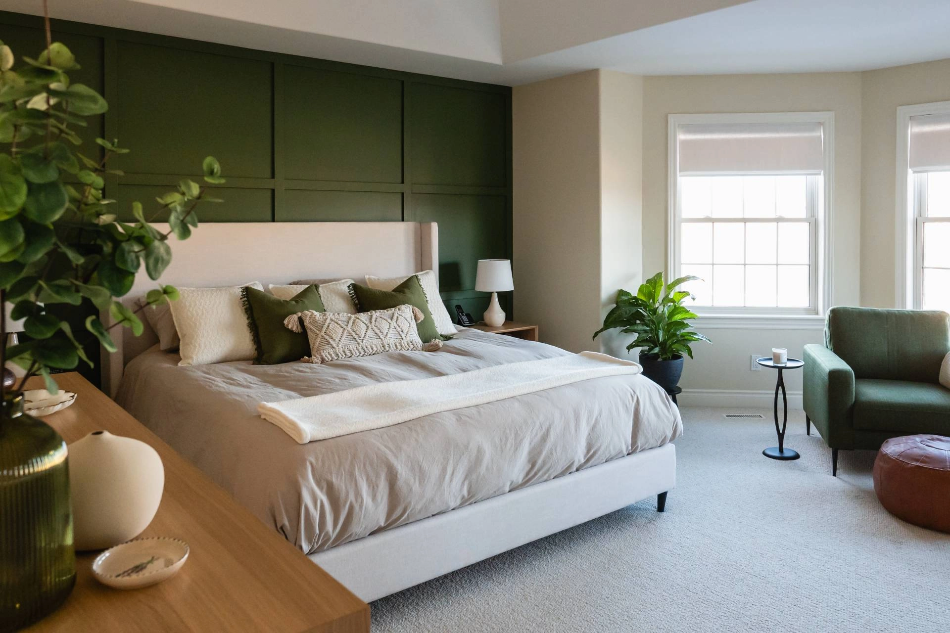 Mid century modern bedroom with green walls, vintage furniture, and custom shades.