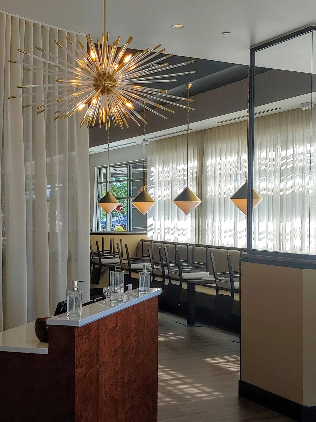 A restaurant with window treatments.