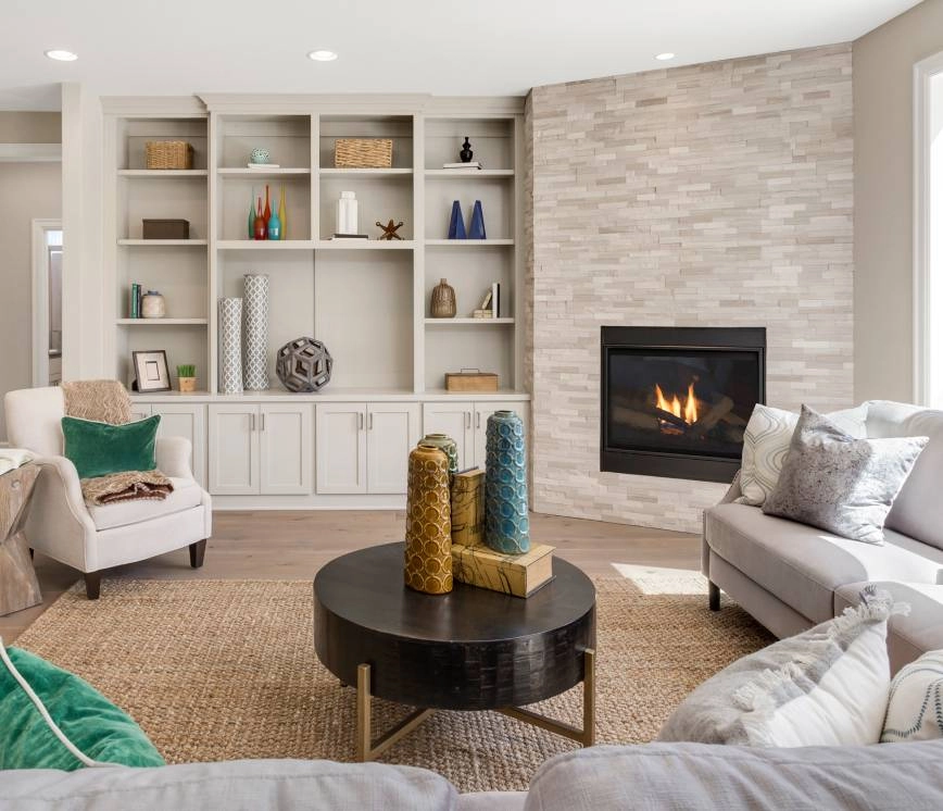 A staged living room with a sofa, end table, accent chair, and accessories near Fort Myers, FL