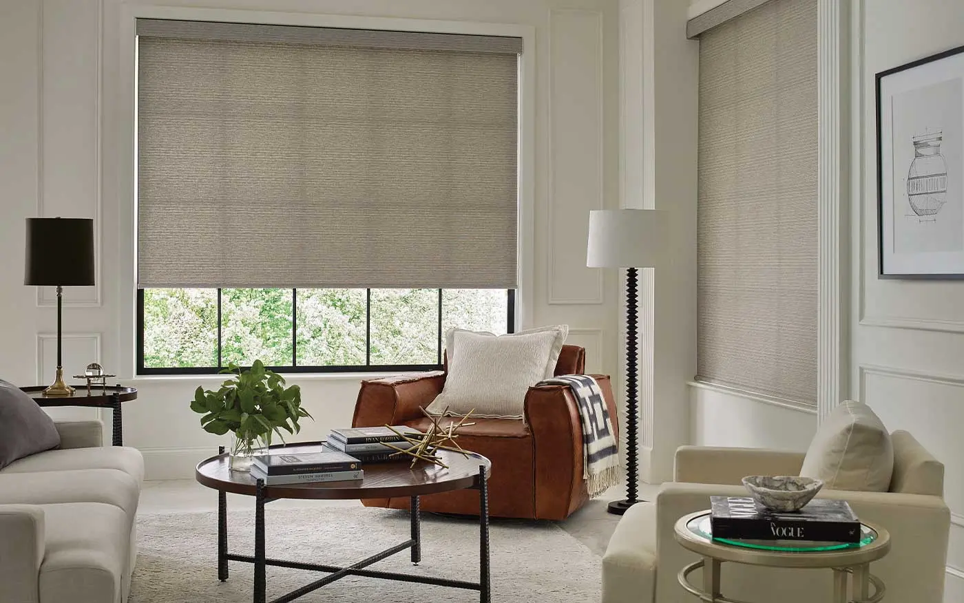 Living room with windows featuring Hunter Douglas shades.