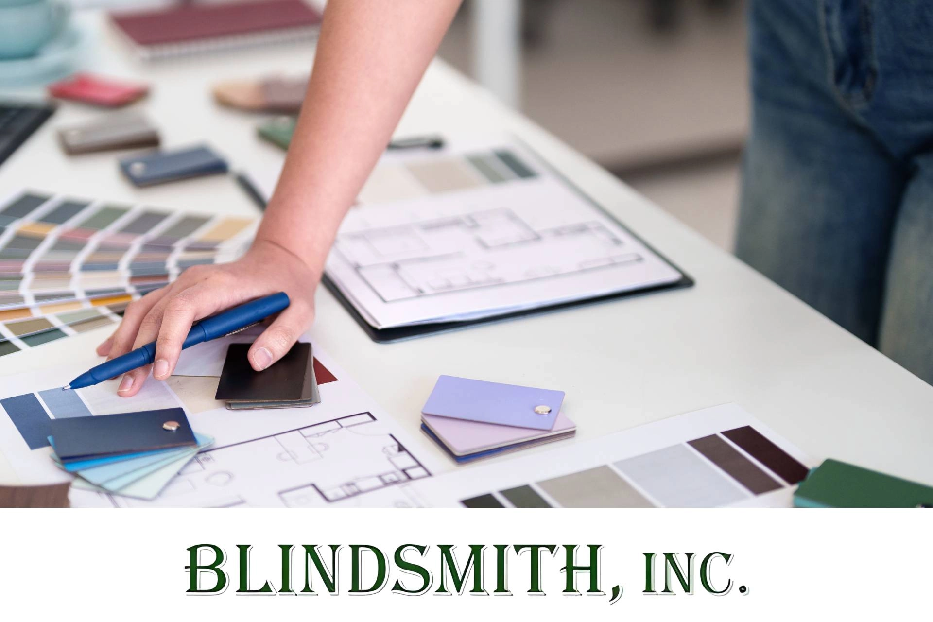 A designer prepares for a window treatment consultation with color swatches and material samples near Arvada, CO.