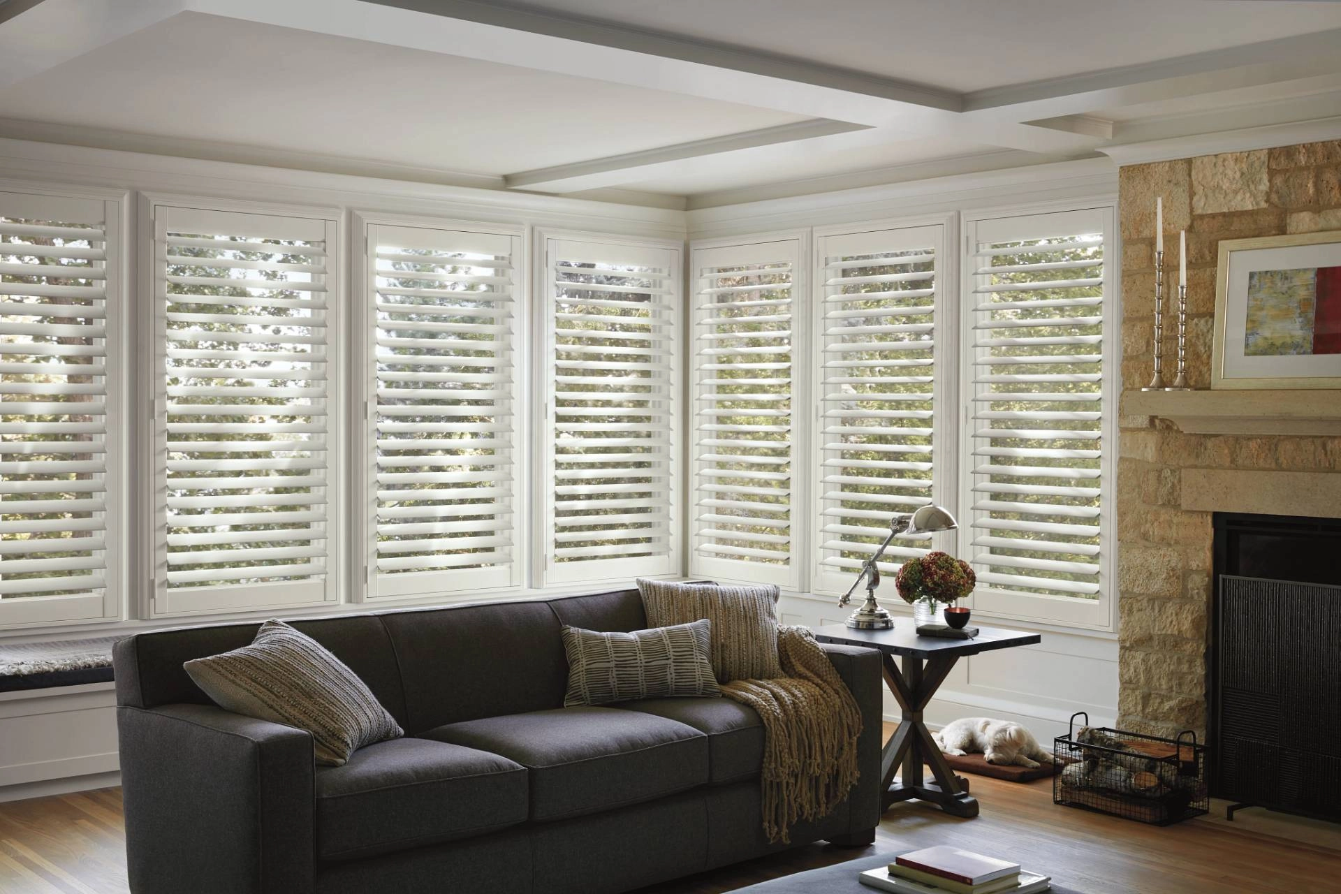 NewStyle® Composite Shutters installed on bay windows in a living room near Mobile, AL.