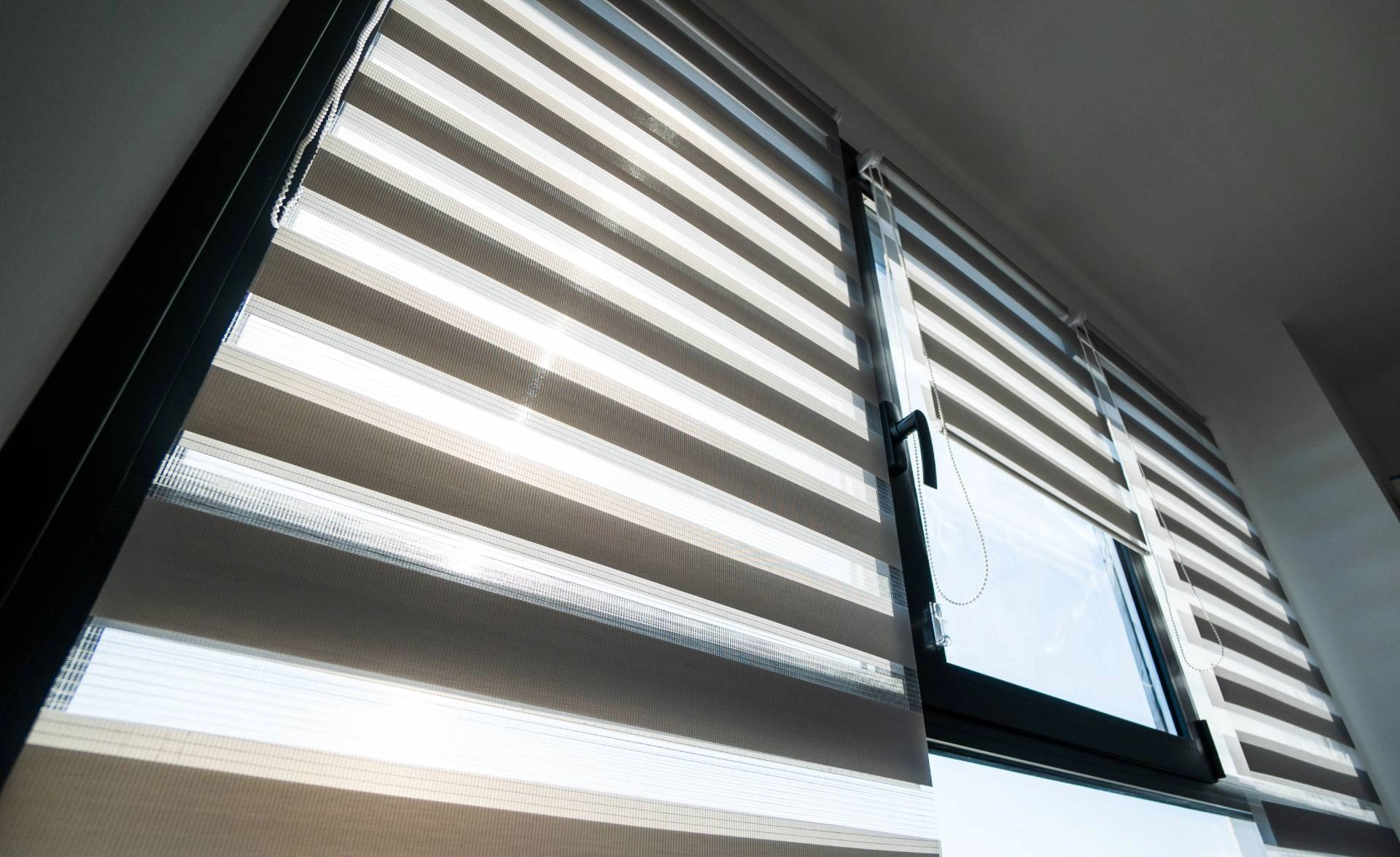 Hunter Douglas Designer Banded Shades on three large windows in a residential home near Mishawaka, IN