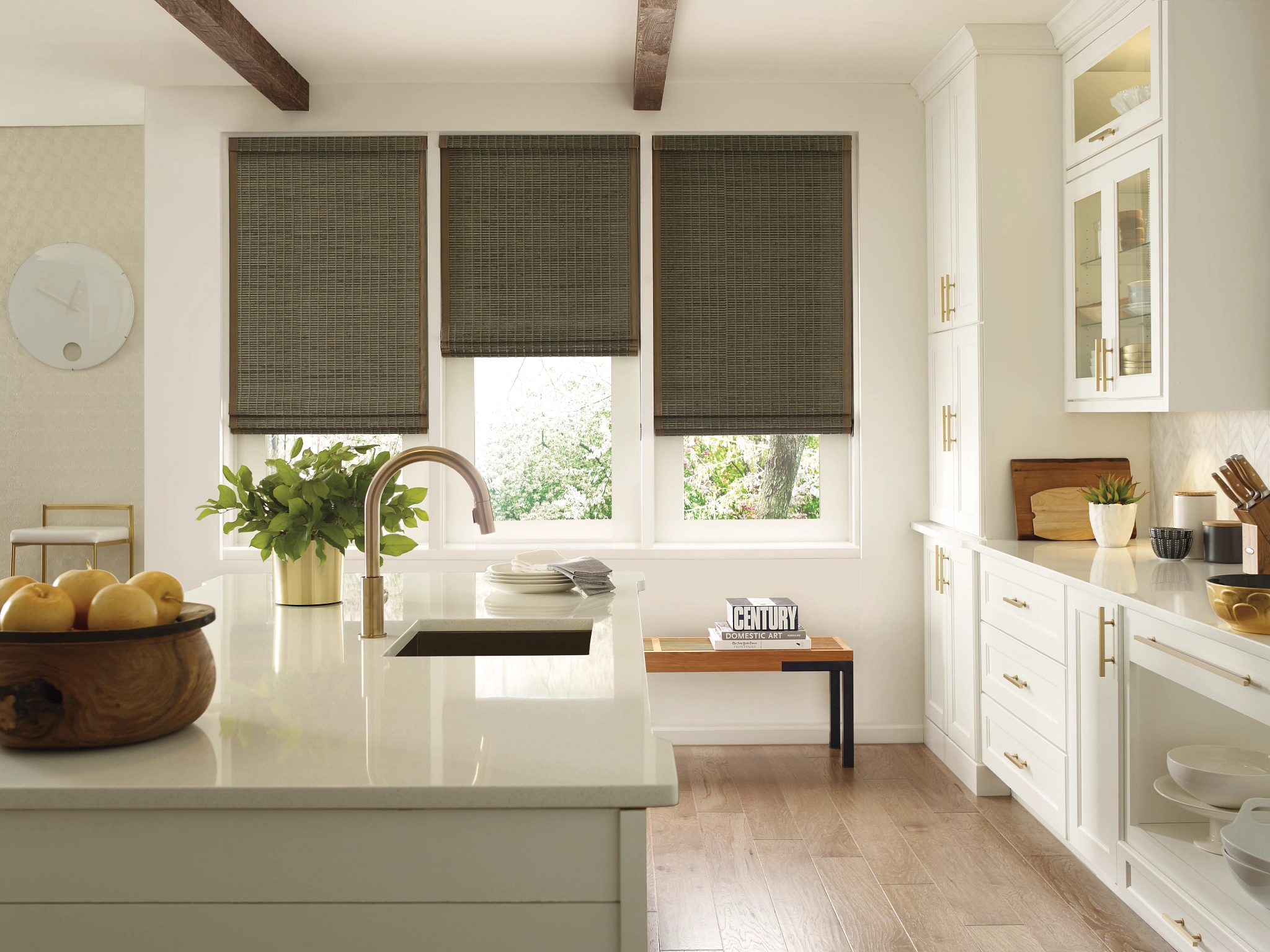 Hunter Douglas Provenance® Woven Wood Shades covering three windows in a kitchen near Gresham, OR.