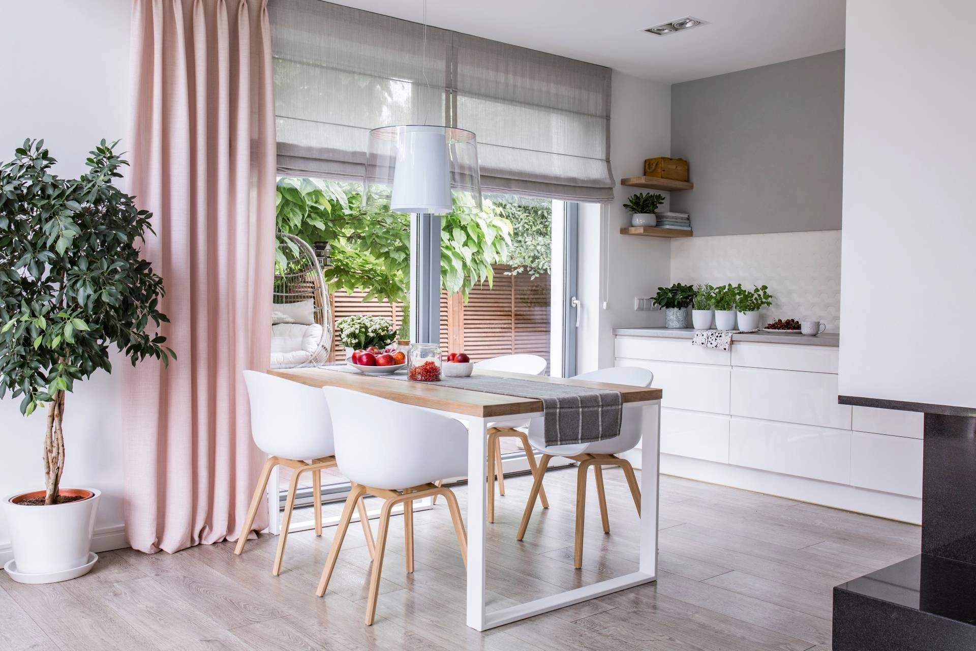 Custom roman shades covering a sliding glass door.