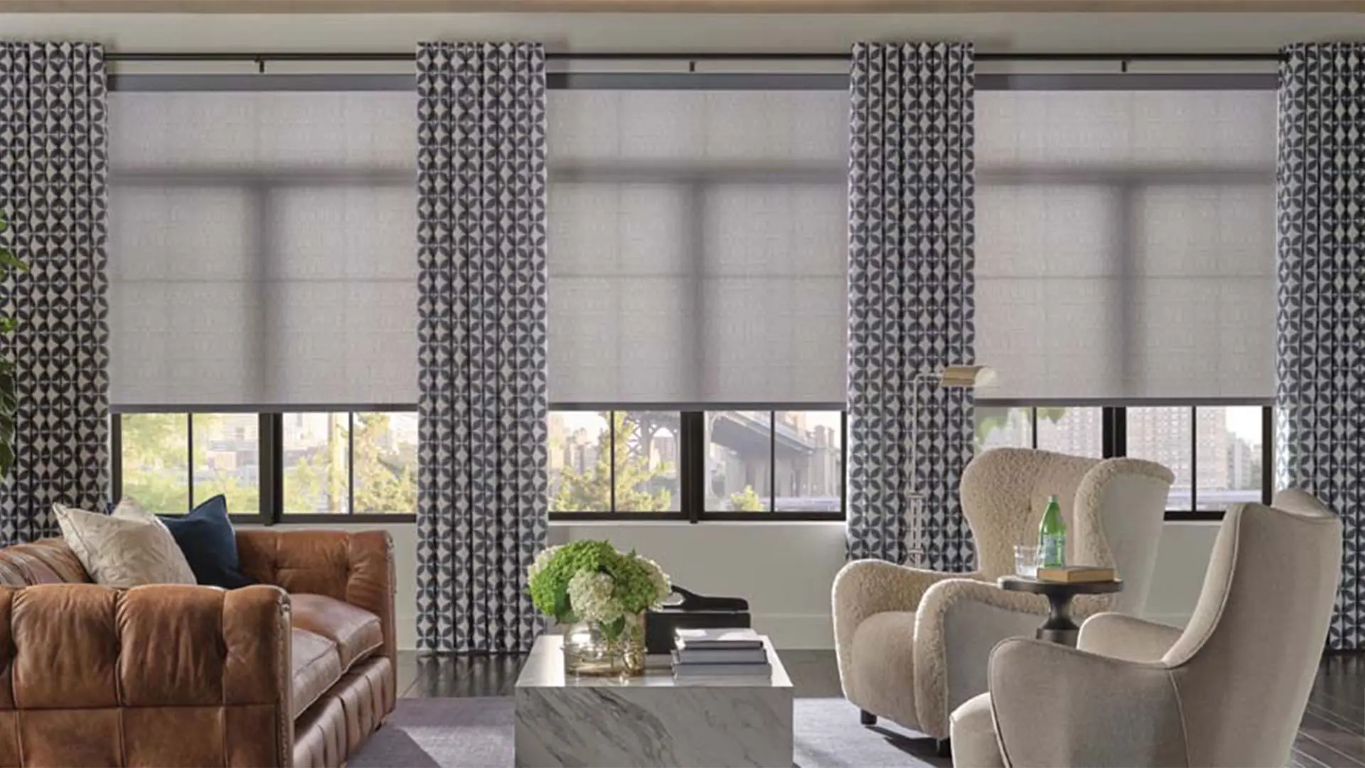 Living room with large windows featuring Hunter Douglas Shades.