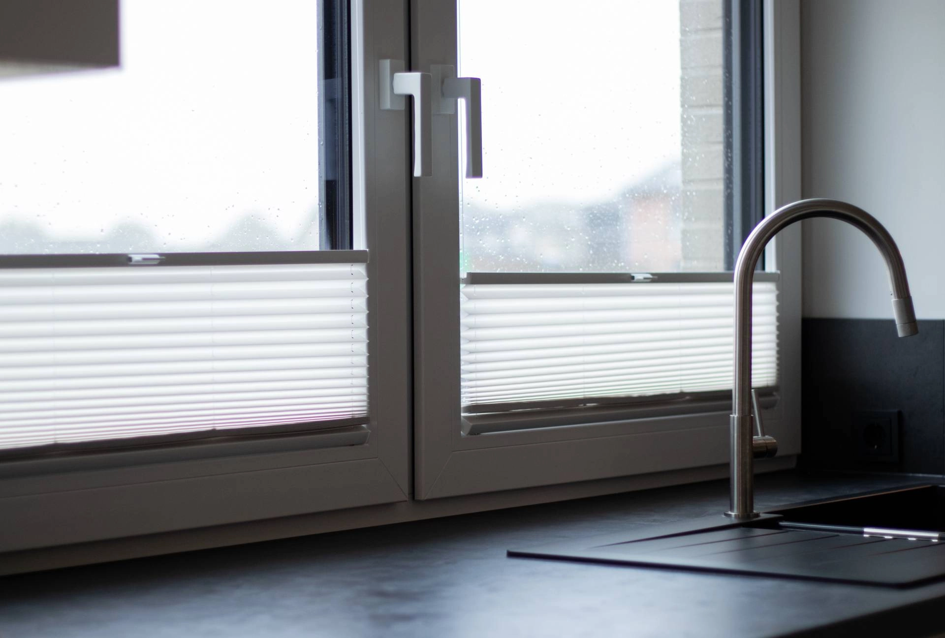 Cellular shades on a window behind a kitchen sink near Key West, Florida