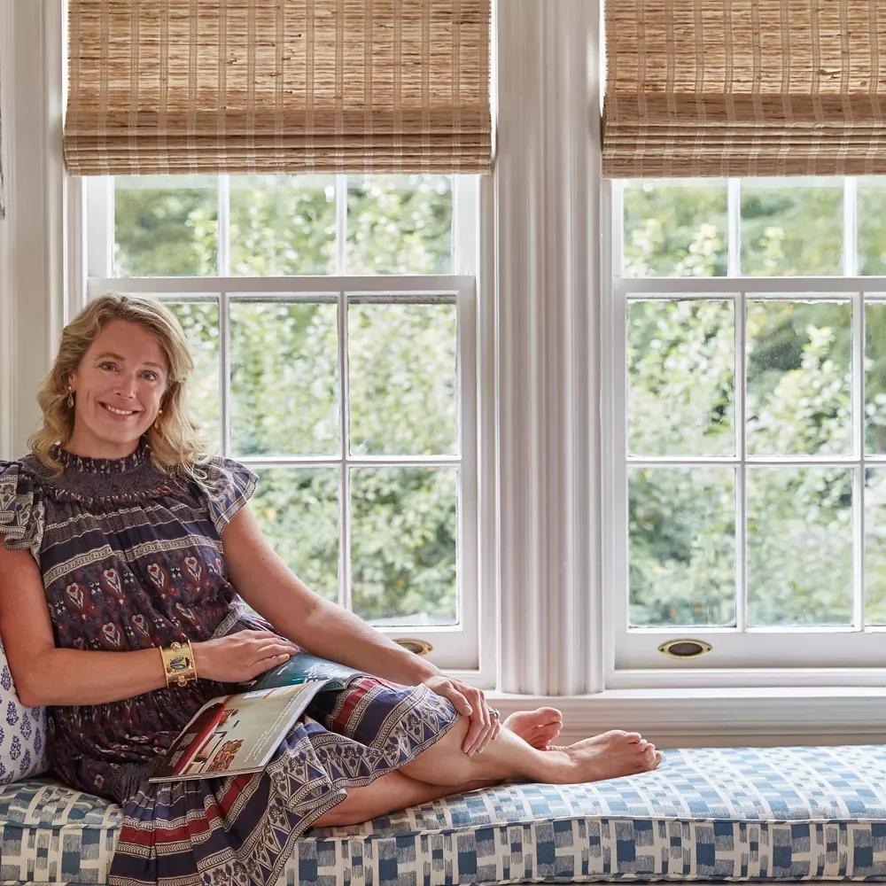 Parker Bowie Larson sitting next to a window