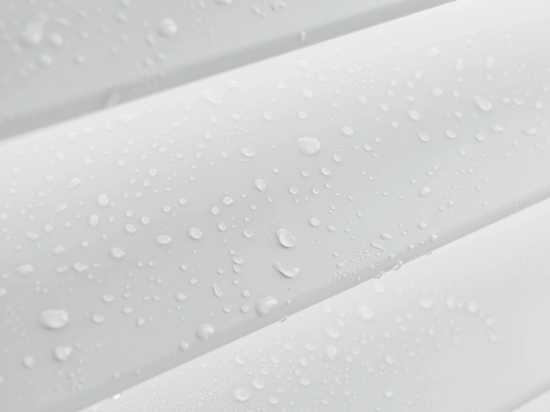 Moisture droplets beading up on Hunter Douglas Palm Beach™ Polysatin™ Vinyl Shutters representing why repainting vinyl shutters is a bad idea.