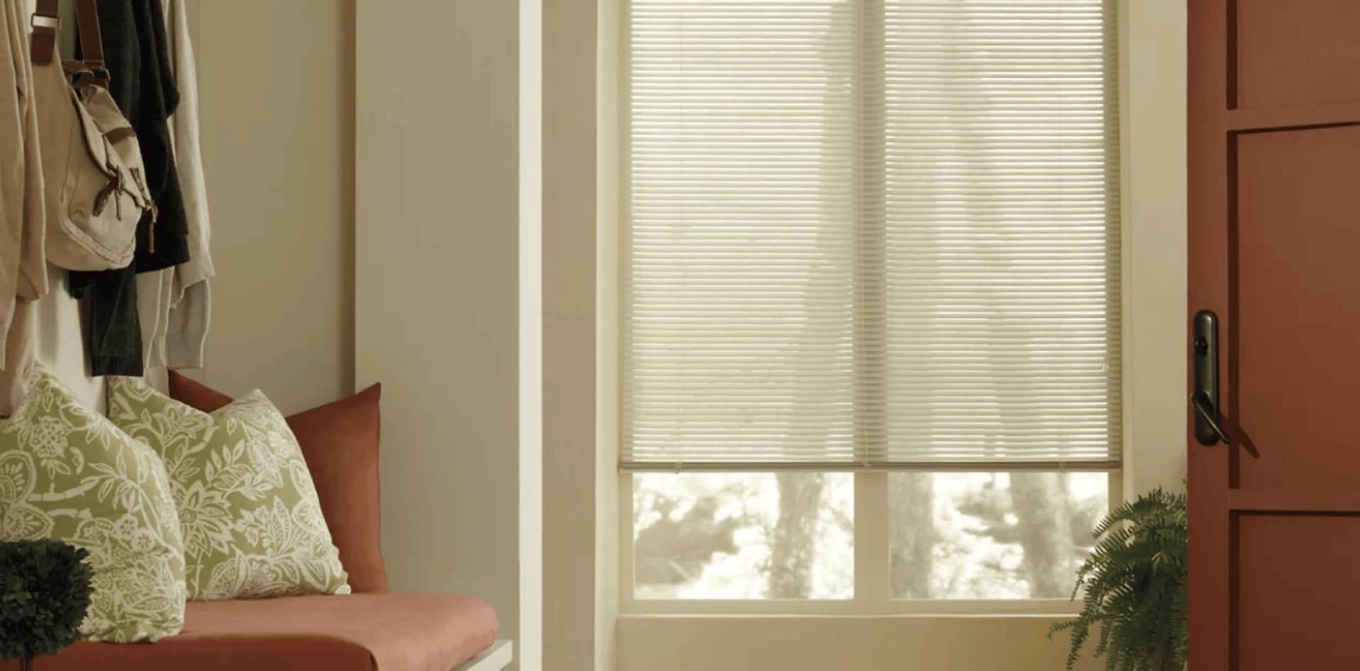 Hunter Douglas Modern Precious Metals® Mini Blinds covering an entryway window.