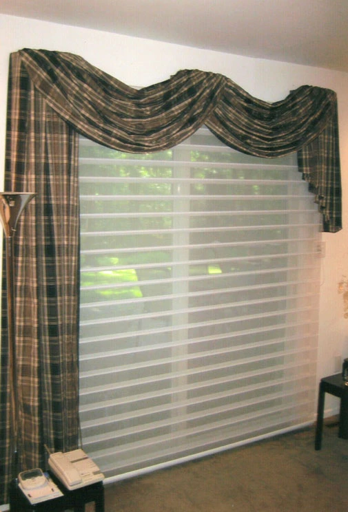 Drapery and blinds in a window.