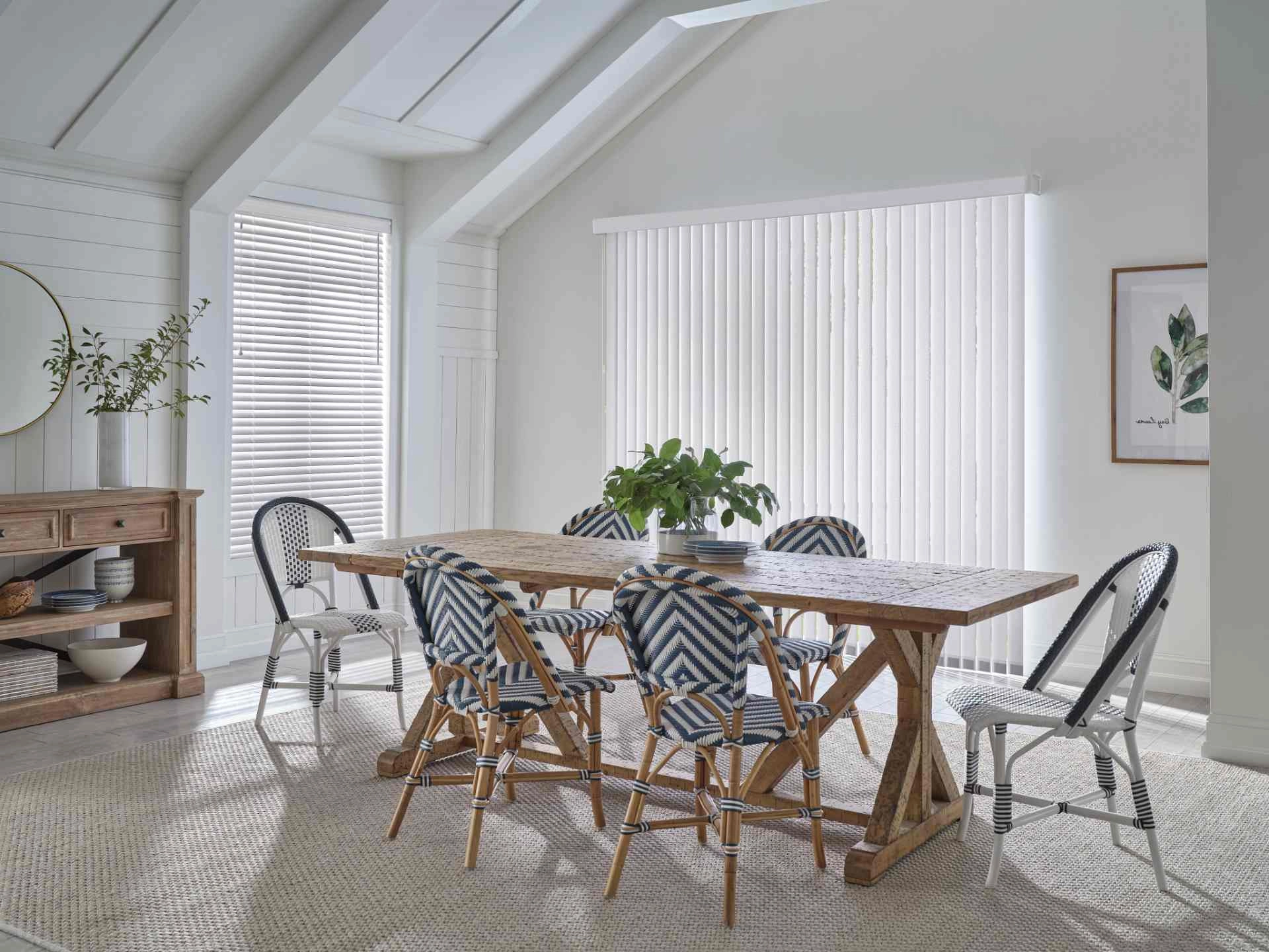 Vertical large window blinds covering a large window in a dining room. near Anaheim, CA